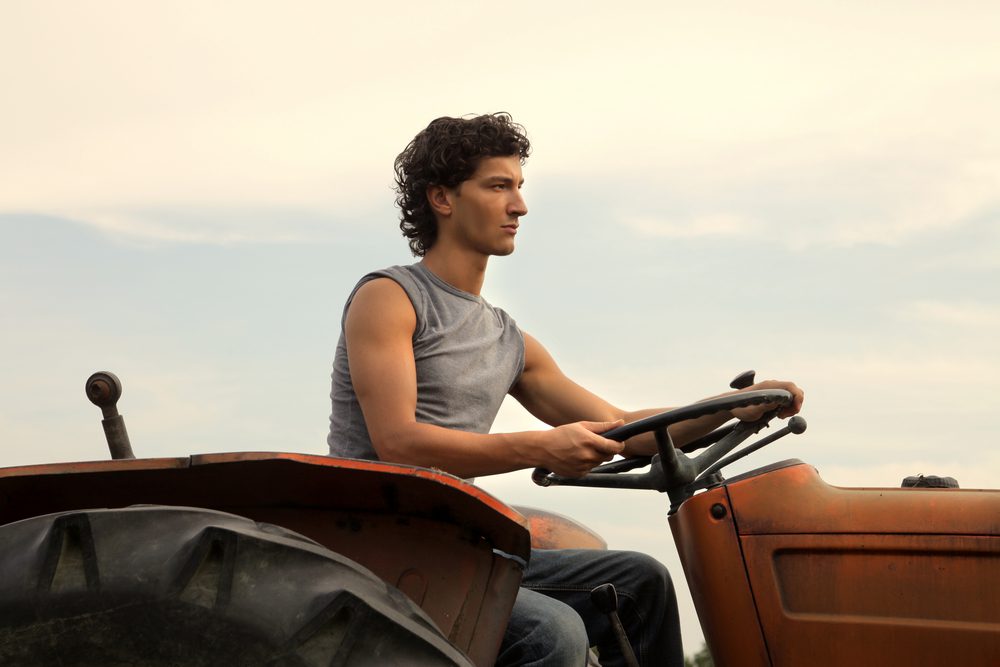 permaculture farmer on a tractor