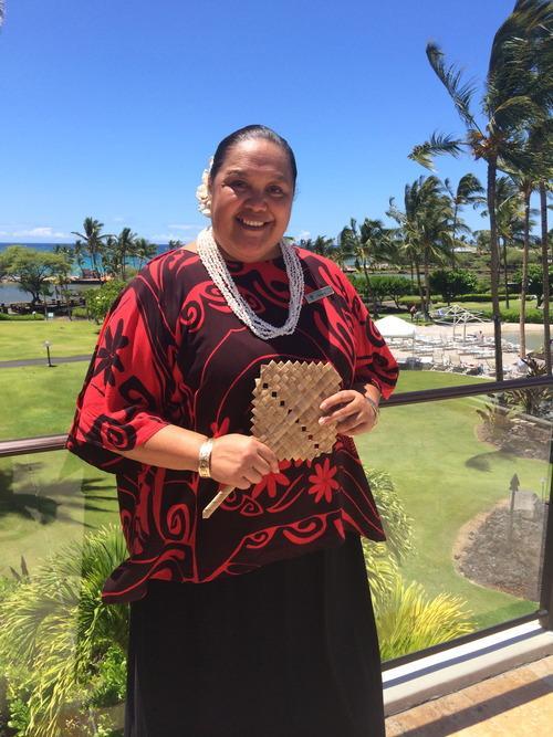 Hawaii Ecotourism representative standing in traditional Hawaiian clothing