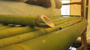 Bamboo shelf on bed
