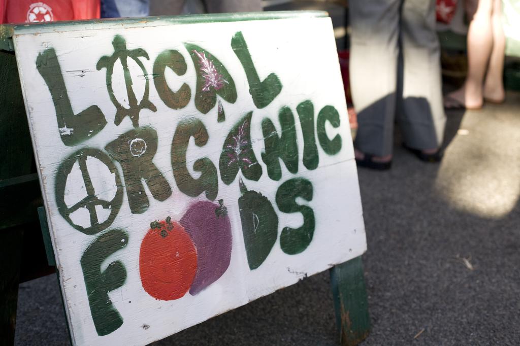 Local Organic Foods sign at permaculture farmers market